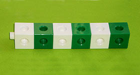 A line of six cubes made of three white-green pairs.